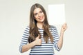 Smiling girl holding advertising banner shows thumb up.