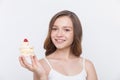 Smiling girl holding cupcake Royalty Free Stock Photo