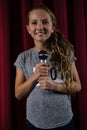 Girl holding microphone on stage Royalty Free Stock Photo