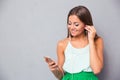 Smiling girl listening music on smartphone Royalty Free Stock Photo