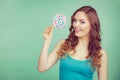 Smiling girl with lollipop candy on teal Royalty Free Stock Photo