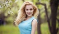 Smiling girl natural beauty, lovely female walking spring nature, portrait of young lovely woman in spring flowers Royalty Free Stock Photo