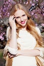 Smiling girl in peach garden Royalty Free Stock Photo