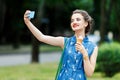 Smiling girl with pink ice cream Royalty Free Stock Photo