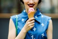 Smiling girl with pink ice cream Royalty Free Stock Photo