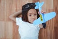 Smiling girl playing with toy airplane Royalty Free Stock Photo