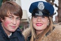 Smiling girl with police cap and her boyfriend.