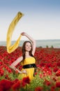 Smiling girl in the poppy field Royalty Free Stock Photo