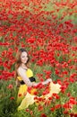 Smiling girl in poppy field Royalty Free Stock Photo