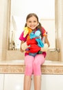 Smiling girl posing with cleansers in bottles at bathroom Royalty Free Stock Photo