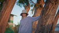 Smiling girl posing trees on lake bank in evening. Casual woman resting outdoors Royalty Free Stock Photo