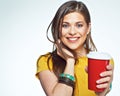 Smiling girl posing on white background with red coffee cup. Royalty Free Stock Photo