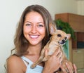 Smiling girl with Russkiy Toy Terrier