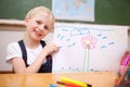 Smiling girl showing her drawing Royalty Free Stock Photo