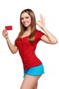 Smiling girl showing red card in hand Royalty Free Stock Photo