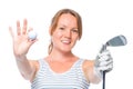 Smiling girl shows a camera in the ball and a golf club Royalty Free Stock Photo