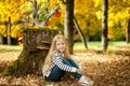 Smiling girl in the autumn park Royalty Free Stock Photo