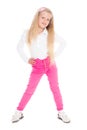 Smiling girl six years in pink jeans.