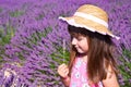 Smiling girl sniffing flowers in a lavender field Royalty Free Stock Photo