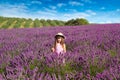 Smiling girl sniffing flowers in a lavender field Royalty Free Stock Photo