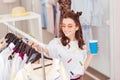 Smiling girl spending her leisure time in shopping mall Royalty Free Stock Photo