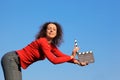 Smiling girl standing in hands clapperboard