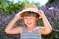 Smiling girl with straw hat in lavender field Royalty Free Stock Photo