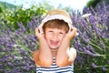 Smiling girl with straw hat in lavender field Royalty Free Stock Photo