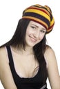 Smiling girl in striped beret on white backgroun