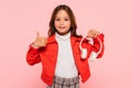 smiling girl in stylish orange jacket