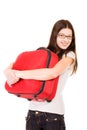 Smiling girl with suitcase on a white background Royalty Free Stock Photo