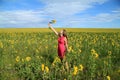 Smiling girl with a sunflower