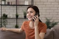 Smiling girl talk on cellphone call at home Royalty Free Stock Photo