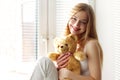 Smiling girl with a teddy bear Royalty Free Stock Photo