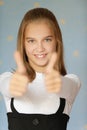 Smiling girl-teenager raised his Royalty Free Stock Photo