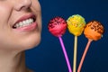 Smiling girl with three cakepops Royalty Free Stock Photo