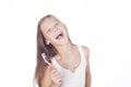 Young girl is brushing her teeth.