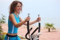 Smiling girl on training apparatus Royalty Free Stock Photo