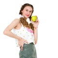 Smiling girl with two braids holding green apple Royalty Free Stock Photo