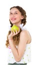Smiling girl with two braids holding green apple Royalty Free Stock Photo