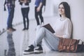 Smiling Girl is Waiting for Lecture in the Hall.