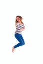 Smiling girl in white blank t-shirt jumping Royalty Free Stock Photo