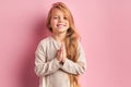 Smiling girl in white blouse isolated on pink background Royalty Free Stock Photo