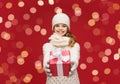 smiling girl in winter clothes with christmas gift Royalty Free Stock Photo