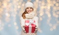 Smiling girl in winter clothes with christmas gift Royalty Free Stock Photo