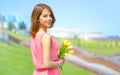 Smiling girl with yellow tulips Royalty Free Stock Photo