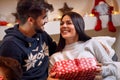 Smiling girlfriend and boyfriend with gift boxes