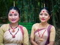 Smiling girls closeup shot dressed in traditional wearing on festival with blurred background