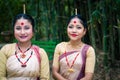 Smiling girls closeup shot dressed in traditional wearing on festival with blurred background