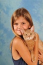 Smiling girls with fawn somali kitten Royalty Free Stock Photo